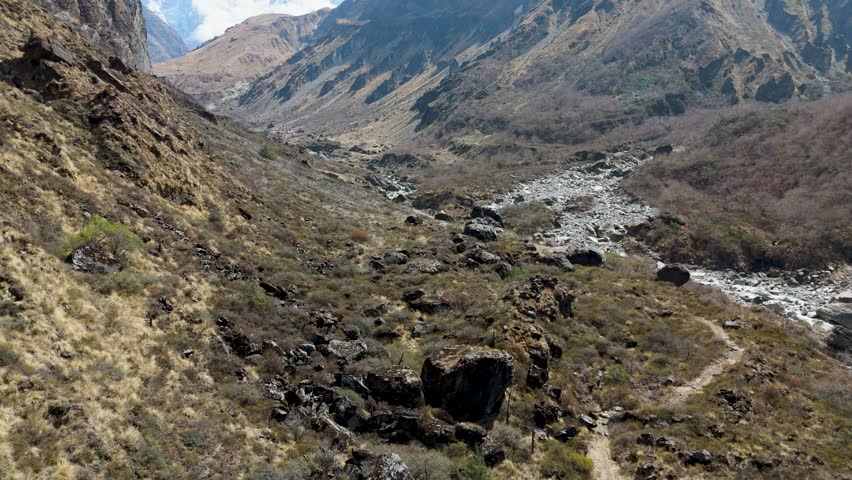 Majestic snowy mountain peak in Nepal. Aerial drone moving in 4k - over beautiful mountains in Nepal cold snow winter landscape. Aerial winter landscape snow covered mountains