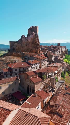 Aerial view of the medieval village of Frias, Burgos, Castilla Leon, northern Spain. Picturesque stone village with a historic castle, surrounded by scenic rural landscape
