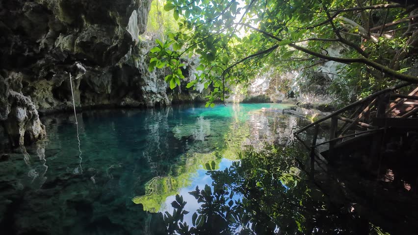A Scenic view of crystal blue natural Maalum Senot swimming pool in Paje, Zanzibar