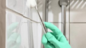 Bathroom Cleaning Concept – Scrubbing Tiles in Close Up.4k. - Powered by Shutterstock - Get 15% off with code: PIKWIZARD15