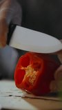 Close up of street food chef cutting vegetables red pepper for making fresh salad appetizers. Making red pepper for tomato sauce in fast food cafe - Powered by Shutterstock - Get 15% off with code: PIKWIZARD15