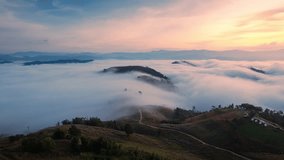 Hyperlapse aerial view of beautiful sunrise over sea of fog flowing over deforested mountain during harvest in countryside at Mae Jam, Chiang Mai, Thailand - Powered by Shutterstock - Get 15% off with code: PIKWIZARD15