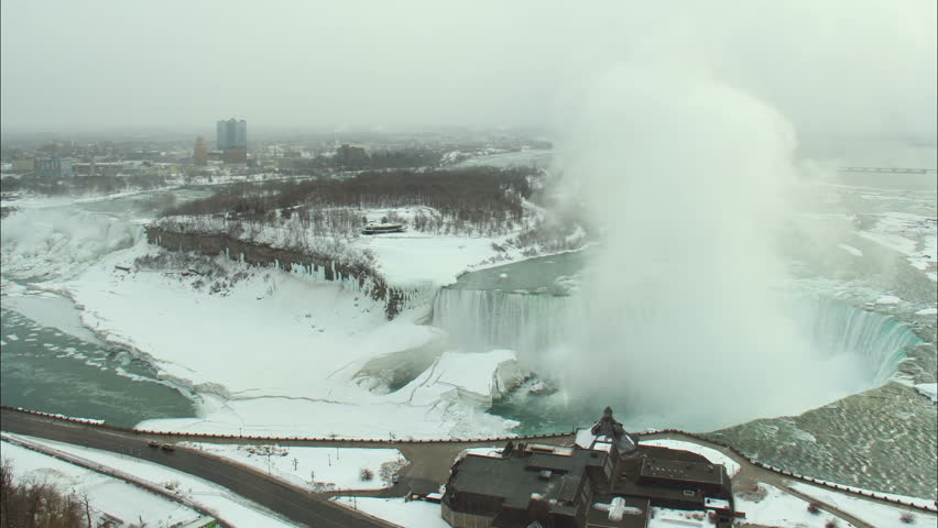 Timelapse shot of Niagara Falls, on the border of New York and Ontario, as viewed from a high-rise hotel on the Canadian side looking at the American side in February, 2014. Shot during winter.