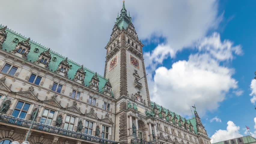 Building of the Hamburg City Hall timelapse hyperlapse, the seat of the government of Hamburg, located in the Altstadt quarter in the city center. Front view from the main square under a cloudy sky