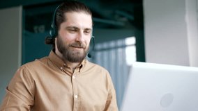 Corporate operator in headset working in customer support service on helpline telesale talking using laptop in business office. Agent of call center advises the client by answering questions. Close up - Powered by Shutterstock - Get 15% off with code: PIKWIZARD15