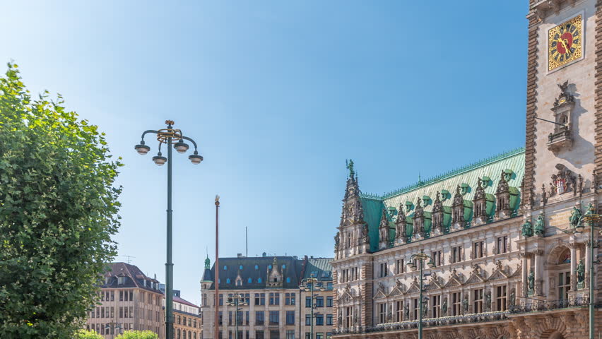 Building of the Hamburg City Hall timelapse, the seat of the government of Hamburg, located in the Altstadt quarter in the city center. Front view from the main square under a blue clear sky