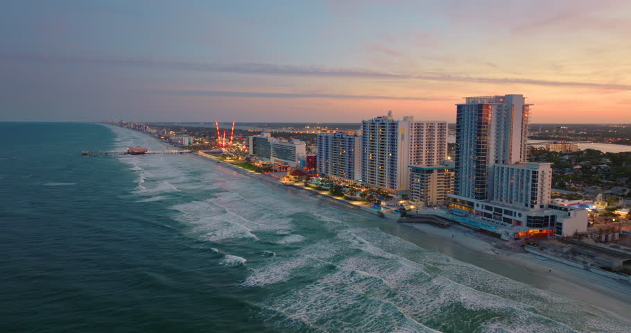 Daytona Beach, Florida. Tourist infrastructure with brightly illuminated luxury hotels and condos in southern USA.