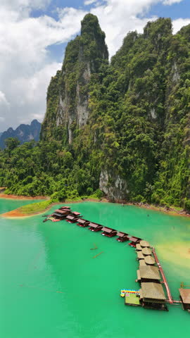 Experience stunning drone footage of Phukets turquoise waters and limestone hills. Its a tropical paradise ideal for thrilling adventures, unforgettable getaways, and lasting memories in Thailand
