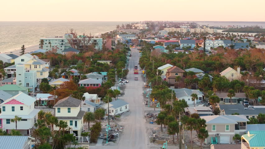 Hurricane Milton storm surge severe damage to waterfront house on Manasota Key, Florida. Destroyed home on gulf coast.