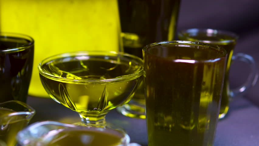 Oil in bottles. Industrial production of sunflower oil. Conveyor line for bottling and packing. Sunflower oil plant.