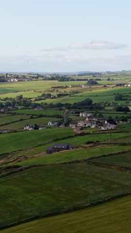 Explore the serene Irish countryside with sweeping landscapes and charming farmhouses.
