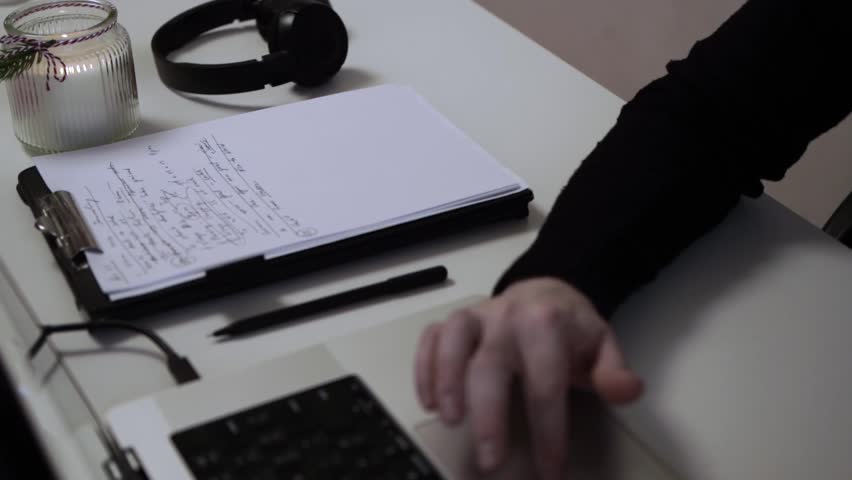 Man Journaling and Working on Laptop - Focused Handwriting in a Notebook to Self-Help During Depression