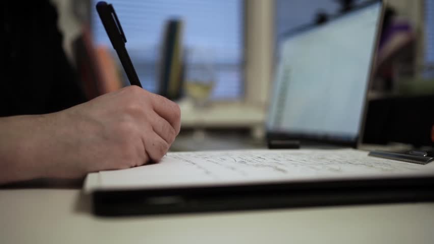 Man Journaling and Working on Laptop - Focused Handwriting in a Notebook to Self-Help During Depression