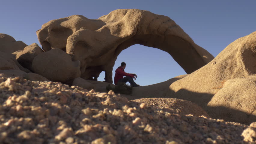 Delicate Arch With Alone Tourist At National Park
