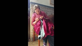 Older woman carefully mending clothing. Close-up shot of hands sewing - Powered by Shutterstock - Get 15% off with code: PIKWIZARD15