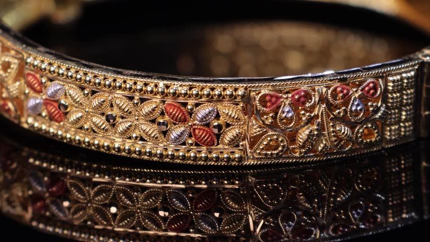 Traditional Indian design gold bangle. Fancy designer antique golden Bangles also known as "sone ka Kada" or "sone ka kangan". Indian Temple jewellery exclusive collection with gemstones.