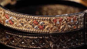 Traditional Indian design gold bangle. Fancy designer antique golden Bangles also known as "sone ka Kada" or "sone ka kangan". Indian Temple jewellery exclusive collection with gemstones. - Powered by Shutterstock - Get 15% off with code: PIKWIZARD15