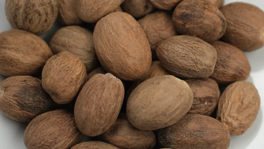 Dried Spice nutmeg close up, rotation