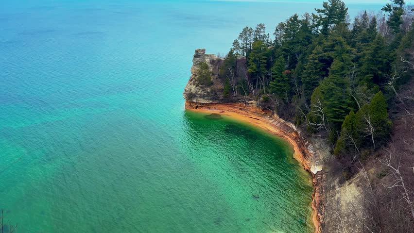 Miners Castle Rock at Pictured Rocks National Lakeshore Michigan during sunset with golden light over cliffs and Lake Superior.