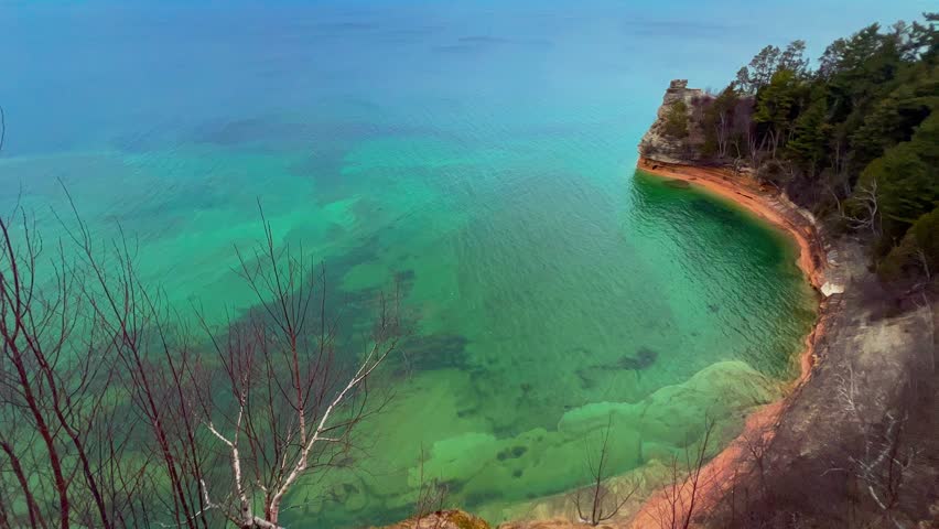Miners Castle Rock at Pictured Rocks National Lakeshore Michigan during sunset with golden light over cliffs and Lake Superior.