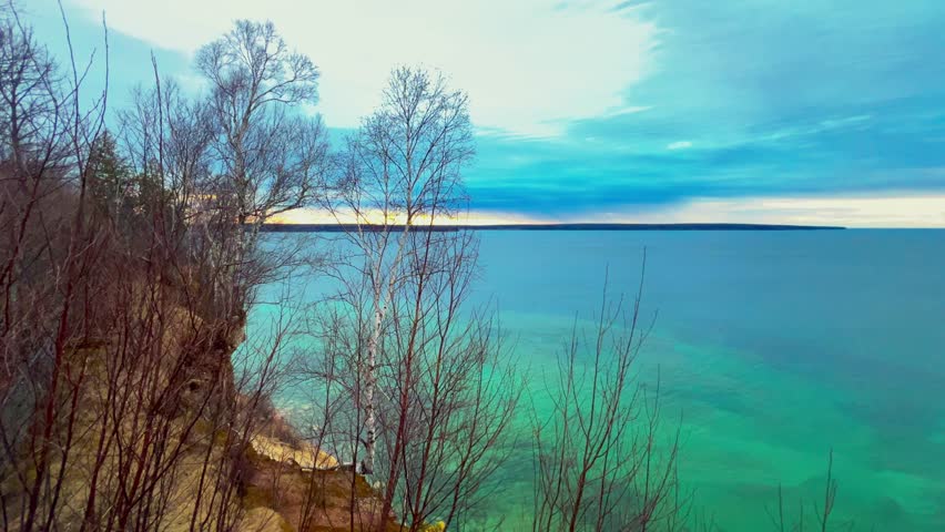 Miners Castle Rock at Pictured Rocks National Lakeshore Michigan during sunset with golden light over cliffs and Lake Superior.