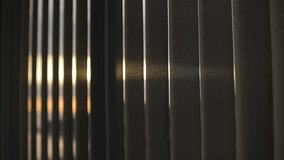 Vertical blinds opening and closing, filtering sunlight through window - Powered by Shutterstock - Get 15% off with code: PIKWIZARD15
