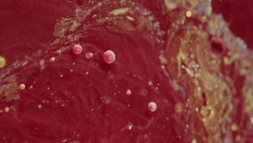 Vertical video. Mixing liquid drops. Diffusion oil paint. Wave jet flow. Round gel bubbles. Chemical process red background combination layering. Art smooth blend swirl. - Powered by Shutterstock - Get 15% off with code: PIKWIZARD15