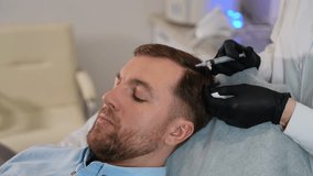 Man receiving scalp injection for hair loss treatment - Powered by Shutterstock - Get 15% off with code: PIKWIZARD15