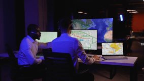 Two logistics dispatchers tracking freight deliveries in real-time - Powered by Shutterstock - Get 15% off with code: PIKWIZARD15