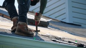 Roofer remover old roof covering. before installing a new roof on an house. Work elements - Powered by Shutterstock - Get 15% off with code: PIKWIZARD15