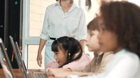 Smart teacher checking student answer while learner using laptop to doing homework, analysis data, programing engineering code and prompt, studying computer system at STEM technology class. Erudition. - Powered by Shutterstock - Get 15% off with code: PIKWIZARD15