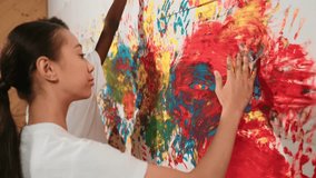 Side view of girl and african boy put the hand in watercolor and stamp on wall. Multicultural children painting color or decorate room with vibrant hand print in art lesson. Creative. Edification - Powered by Shutterstock - Get 15% off with code: PIKWIZARD15