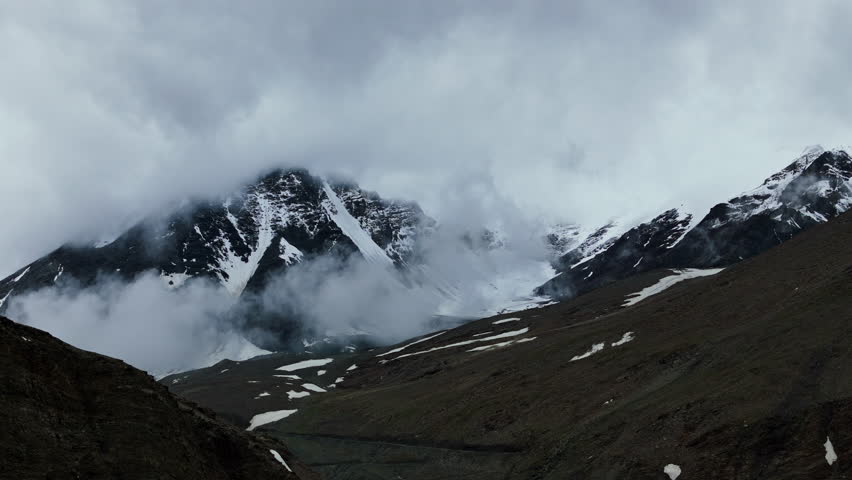 Foggy Snowy Peak In Tibet Himalayas drone view
