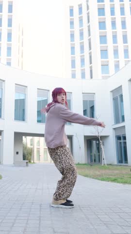 Energetic dancer showcasing fluid movements in a dynamic urban setting, blending street style with contemporary dance