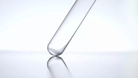 Lab researcher Pipette drop pink transparent liquid sample into test tube in laboratory for scientific analysis - Powered by Shutterstock - Get 15% off with code: PIKWIZARD15