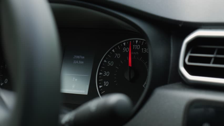 Speedometer of a car that picks up speed quickly while driving. Dashboard of a car that drives more than 100 km\h