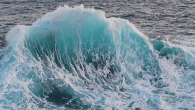 Epic ocean wave with turquoise water. Big power wave splash with white foam, slow motion shot. Sunrise reflecting in ocean water surf. Aerial shot - Powered by Shutterstock - Get 15% off with code: PIKWIZARD15
