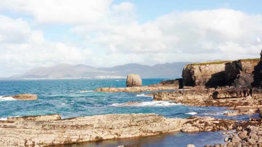 Scenic Irish Seascape with Strong Wind, Crashing Surf, and Coastal Formations