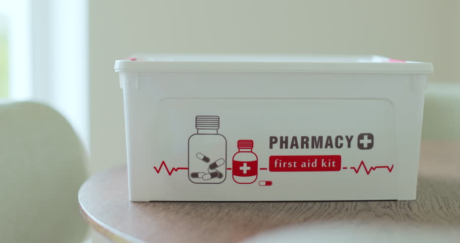 Closed first aid kit bag at home, box object close up. Life saving, medical care, accident helping, emergency health care.