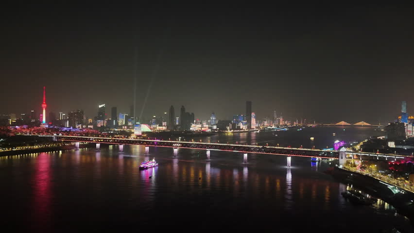 Aerial Wuhan Yangtze River Bridge and city at night, high angle view
