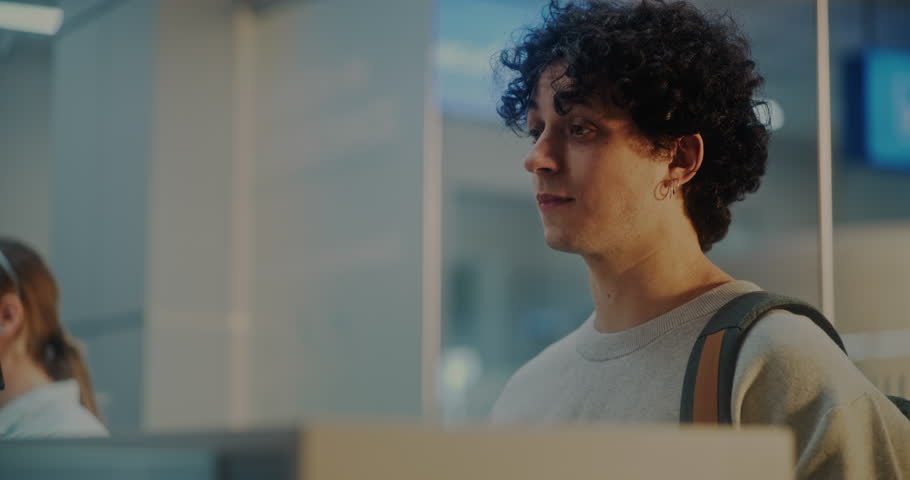 Airport Check-in Counter: Close Up of Young Man, Tourist Giving Documents and Airplane Ticket to Airline Agent in International Airport Terminal. Passenger During Passport Control for Boarding Flight.