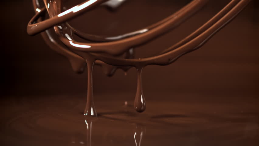 Drops of chocolate drip from the whisk. Filmed on a high-speed camera at 1000 fps. High quality FullHD footage