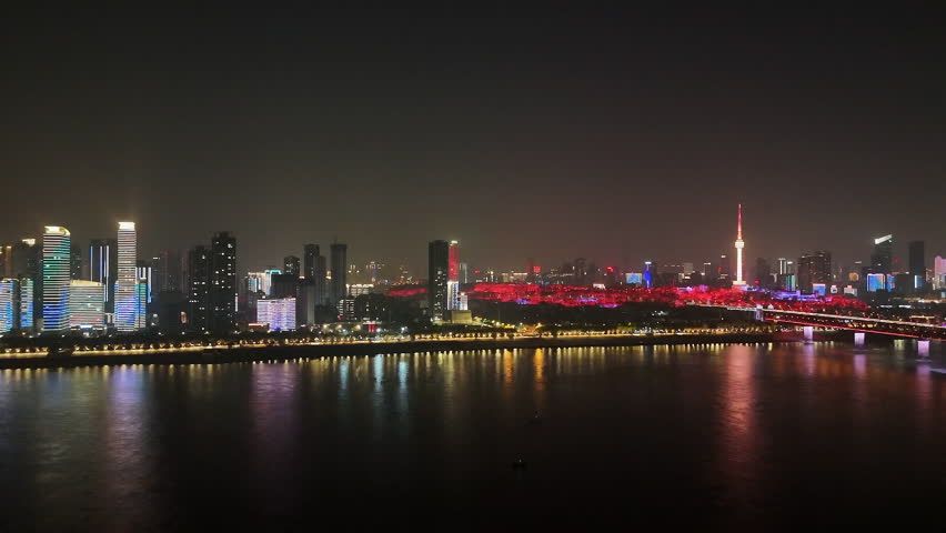aerial panning view Wuhan city landscape and Wuhan Yangtze River Bridge at night