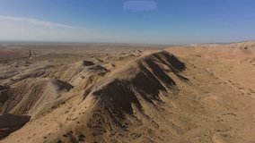 Breathtaking aerial perspectives showcase the ustyurt plateau's unique geological formations, revealing a mesmerizing tapestry of canyons, cliffs, and desert landscapes - Powered by Shutterstock - Get 15% off with code: PIKWIZARD15
