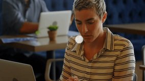 woman and coworker working in business cafe workspace, with floating smartphone music chat icons. Collaboration, connectivity, modern, workspace, digital, communication, technology - Powered by Shutterstock - Get 15% off with code: PIKWIZARD15