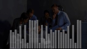 Five business professionals leaning over laptop in dim office showing animated equalizer overlay. Collaboration, teamwork, innovation, modern, workplace, technology, productivity - Powered by Shutterstock - Get 15% off with code: PIKWIZARD15
