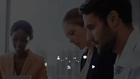 Team collaborating over laptop around desk in tech office, showing floating chat and location icons. Collaboration, teamwork, innovation, workplace, digital, modern, productivity - Powered by Shutterstock - Get 15% off with code: PIKWIZARD15