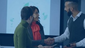 Three professionals discussing marketing data in office showcasing pie charts floating social icons. Corporate, innovation, digital, teamwork, communication, analytics, modern - Powered by Shutterstock - Get 15% off with code: PIKWIZARD15