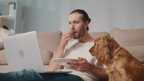 Healthy Routine, Pet Human Nutrition, Digital Balance. Man Works and Eats at Desk While His Dog Enjoys Its Own Food Nearby. Calm, Synchronized Wellness and Everyday Focus - Powered by Shutterstock - Get 15% off with code: PIKWIZARD15