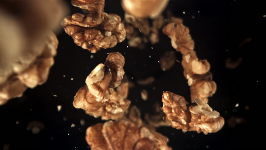 Walnuts fly down. Filmed on a high-speed camera at 1000 fps. High quality FullHD footage